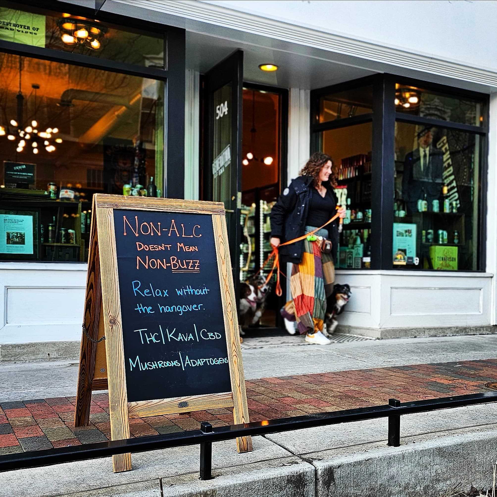 Generation NA storefront with sidewalk sign about non-alc and functional drinks